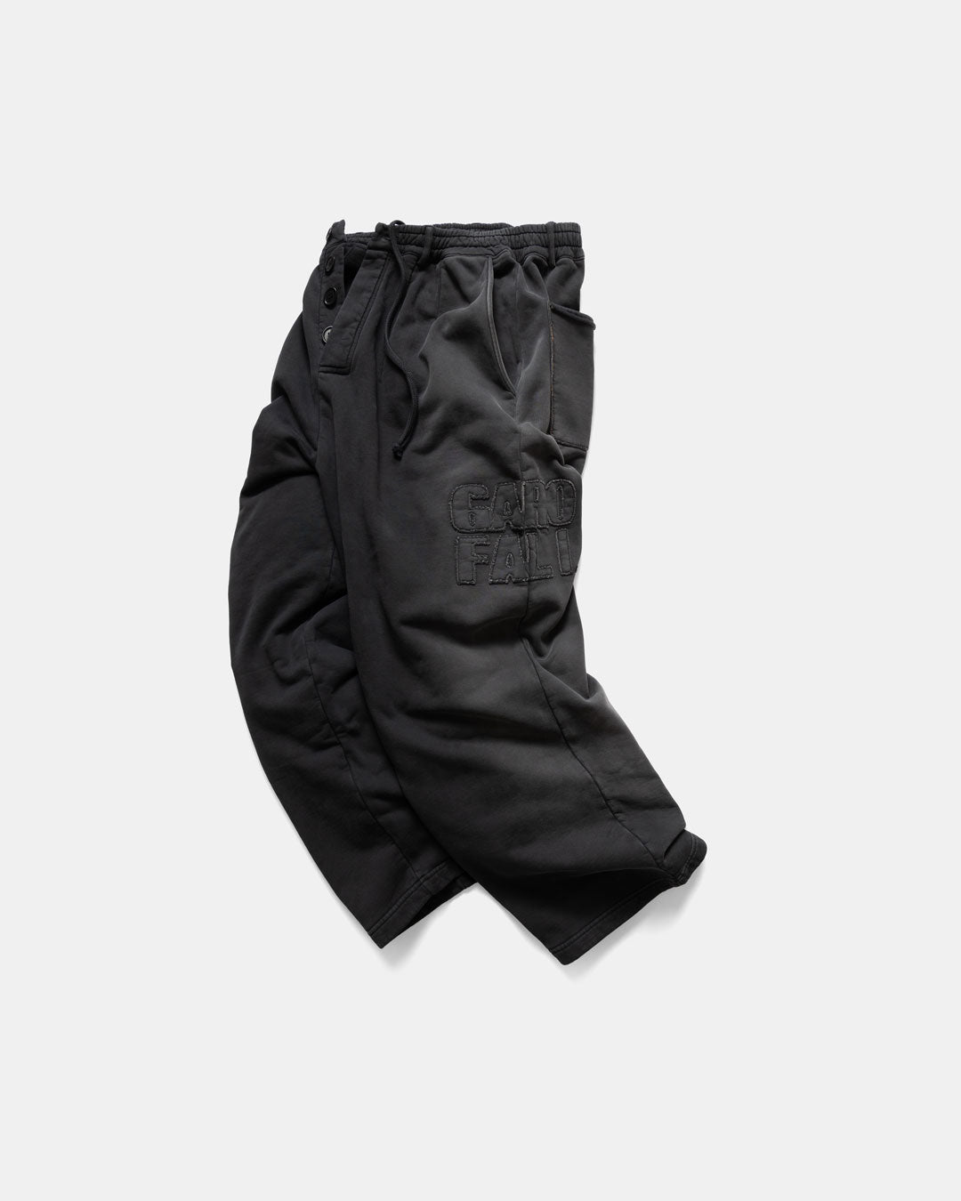 Men's heavyweight sweatpants in black, side view with embroidered logo