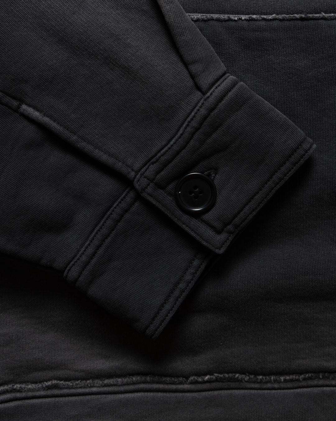 Men's heavyweight hoodie in black, buttoned cuff detail