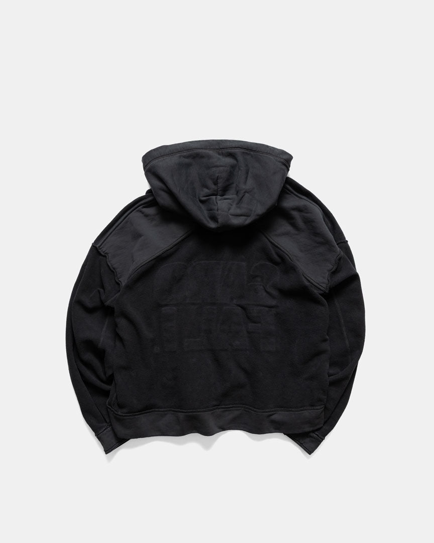 Men's heavyweight hoodie in black, worn inside out, back view